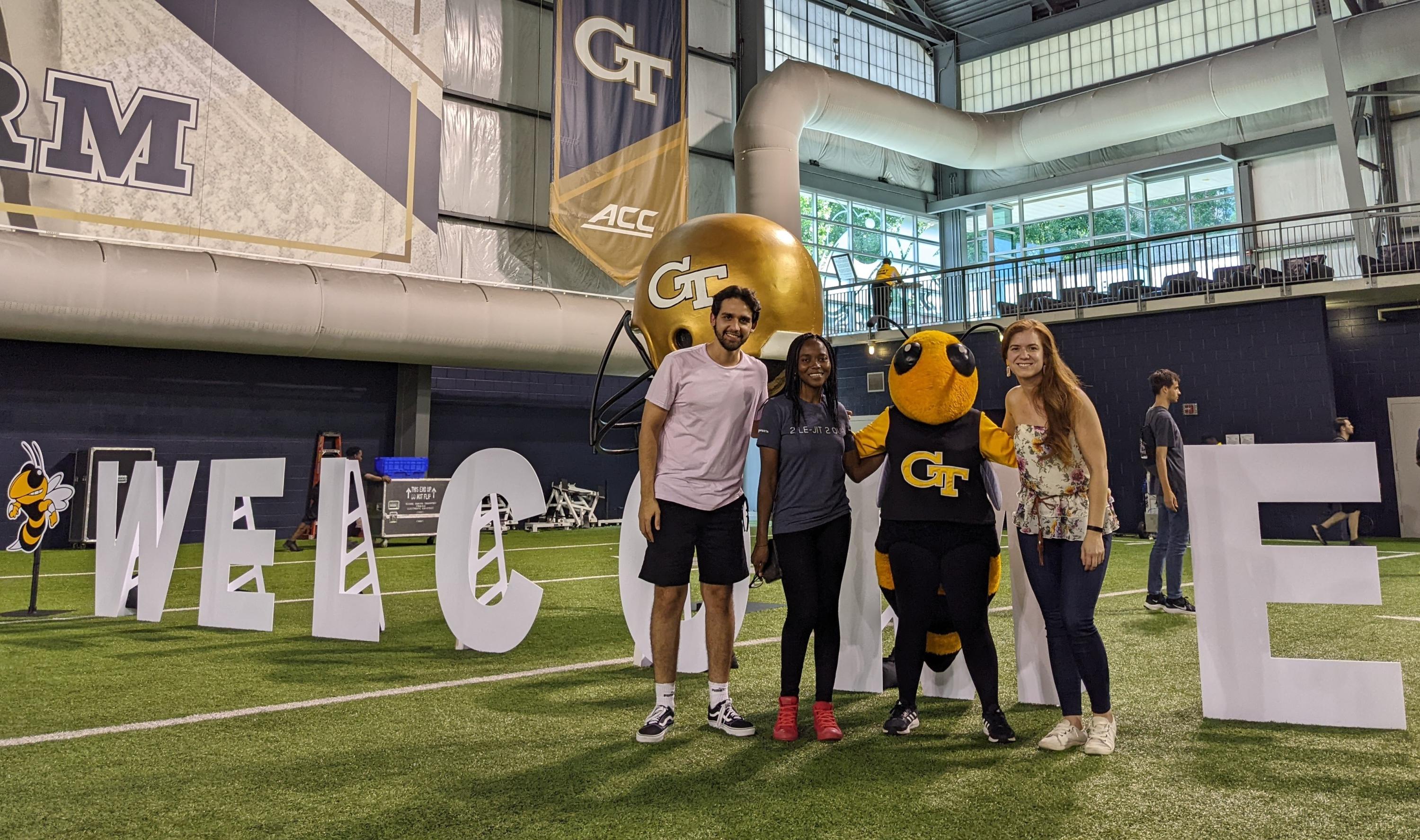 Pictured are Genaro Soto Valle Angulo (ECE), Tinomutenda Chikate (Cybersecurity), Buzz, and Ximena Pizarro Bore (Public Policy)